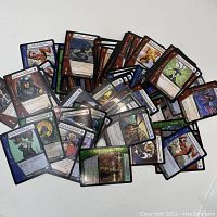 Front image of assorted Gotham trading cards from Upper Deck showing characters and their attributes.