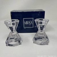 Pair of clear crystal candlesticks displayed with original blue Mikasa box behind them