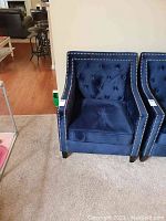 Front view of chair alongside matching chair