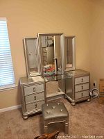 Full front view of vanity table with mirror and stool