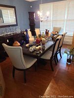 Full view of assembled table with decorative items and chairs around