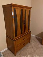 Full view of two-piece unit assembled, showing top cabinet and dresser base