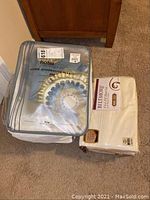 Biltmore Elite sheet set in cream color with 400 thread count, packaged in plastic wrapper.