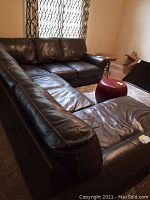 Front perspective showing entire sectional sofa and chaise