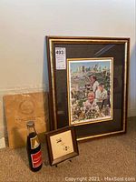 Full view of the framed Georgia Tech football print, centennial paper, framed embroidery, and Coke bottle group