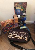 Overall view of the Harry Potter bag with multiple puzzles and trivia game stacked behind it