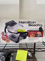 Close up of Hamilton Beach Design Style Flip Waffle Maker box indicating features