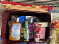Photo showing assorted Bath & Body Works lotions, sprays, and hand creams including Country Chic lotion and Black Cherry Merlot hand cream tube.