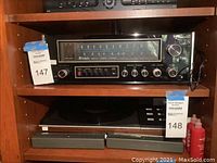 McIntosh MX117 tuner preamp installed in shelf, showing front panel and control knobs