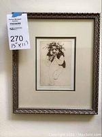 Overall view of framed etching showing subject, mat, and frame