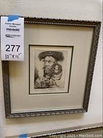 Framed signed and numbered Charles Bragg print measuring 12 by 11 inches with auction tag.