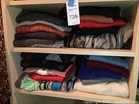 Shelves with folded sweaters in various colors and patterns