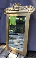Front full view of antique beveled mirror with gold wooden frame, showing overall condition and size