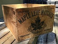 Front view highlighting the Maple Leaf Matches logo with text and origin details on wood box.