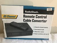 Original box of RadioShack 85 Channel Remote Control Cable Converter with remote and converter shown on box image.