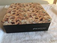 Black box with lid printed with teddy bear design, labeled 'McIntosh Fine Bone China'