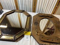 Octagonal framed mirror next to rectangular framed mirror showing overall condition and design details