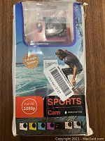 Photo of original packaging showing Full HD 1080p Sports Cam with 2.0-inch screen and waterproof up to 30 meters.