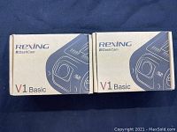 Two boxed Rexing V1 Basic Dash Cam units side by side with packaging showing.