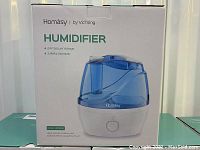 Box of Homasy humidifier showing branding, model number Hum950s, and product image