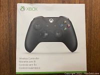 Boxed Xbox Wireless Controller with front view of packaging showing Xbox logo and product image.