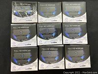 Photo showing nine boxed Full HD webcams arranged in three rows of three, boxes feature black and light gray colors with product branding.