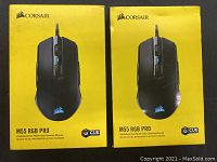 Two yellow boxes, each with Corsair M55 RGB PRO gaming mouse image shown on packaging.