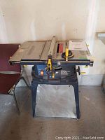 Front view of Mastercraft 10 in table saw on metal stand with work surface and control handles visible.