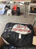 Black carrying bag with Coleman Hydro Fusion 2 in 1 Ride System branding, showing the closed item packed for storage or transport.