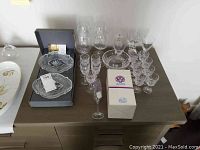Overview of all crystal glassware, dishes and bowl on table