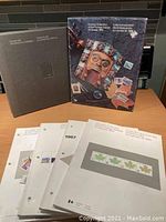Set of Canada Post annual stamp collector books, including 1980 and 1986-1989. Covers feature commemorative art and stamps.