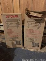 Photo showing two cardboard boxes with printed illustrations and list of included components for Ottoman Kits, one box is unopened, the other opened but complete.