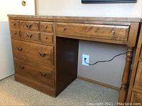 Front angled view showing full desk with drawers and leg support