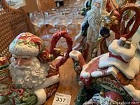 Photo showing close-up of Santa Claus teapot head with red hat, white beard, and detailed facial features.