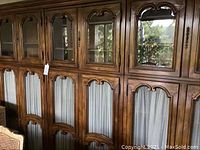 Front view showing six upper glass doors and six lower wire mesh doors