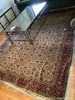 Full view of rug under coffee table showing overall pattern and scale