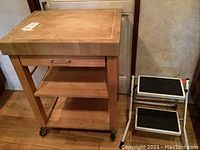 Both butcher block cart and step stool shown together