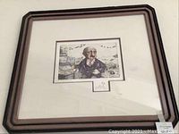Full view of framed artwork showing frame and matting.