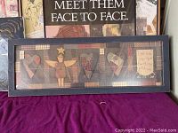 Framed mixed media art titled 'Meet Them Face to Face' featuring stylized figures and hearts, dark wood rectangular frame.
