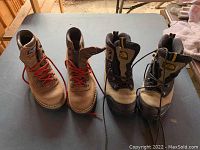 Front view of two pairs of boots side by side showing style and design.