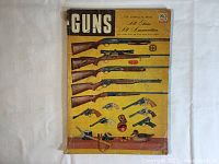Front cover of the 1953 Guns complete book showing illustrations of various rifles and handguns on a yellow background with black and red sections.