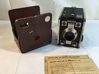 Gevaert Gevabox camera with brown leather case and exposure tables laid out