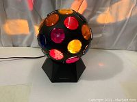 Front view showing multicolored lenses and hexagonal base with RadioShack branding