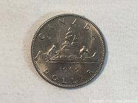 Reverse of 1969 Canada Silver Dollar Coin showing the Bluenose schooner, year 1969, and inscriptions 'CANADA DOLLAR'.