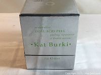 Box front showing product name and volume (2 oz, 60 ml) in silver reflective packaging.