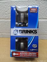 Front view of Brinks packaging showing exterior keyed entry knobs inside.