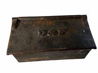 Top view of cast iron drop box lid showing 'D & F' embossed marking.