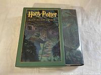 Front of the slipcover and dust jacket side by side showing cover artwork.