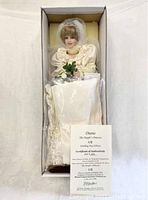 Full view of the Princess Diana doll in her original box including wedding dress and accessories.