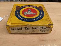 Closed yellow box with O.K. Cub logo and model engine power kit labeling